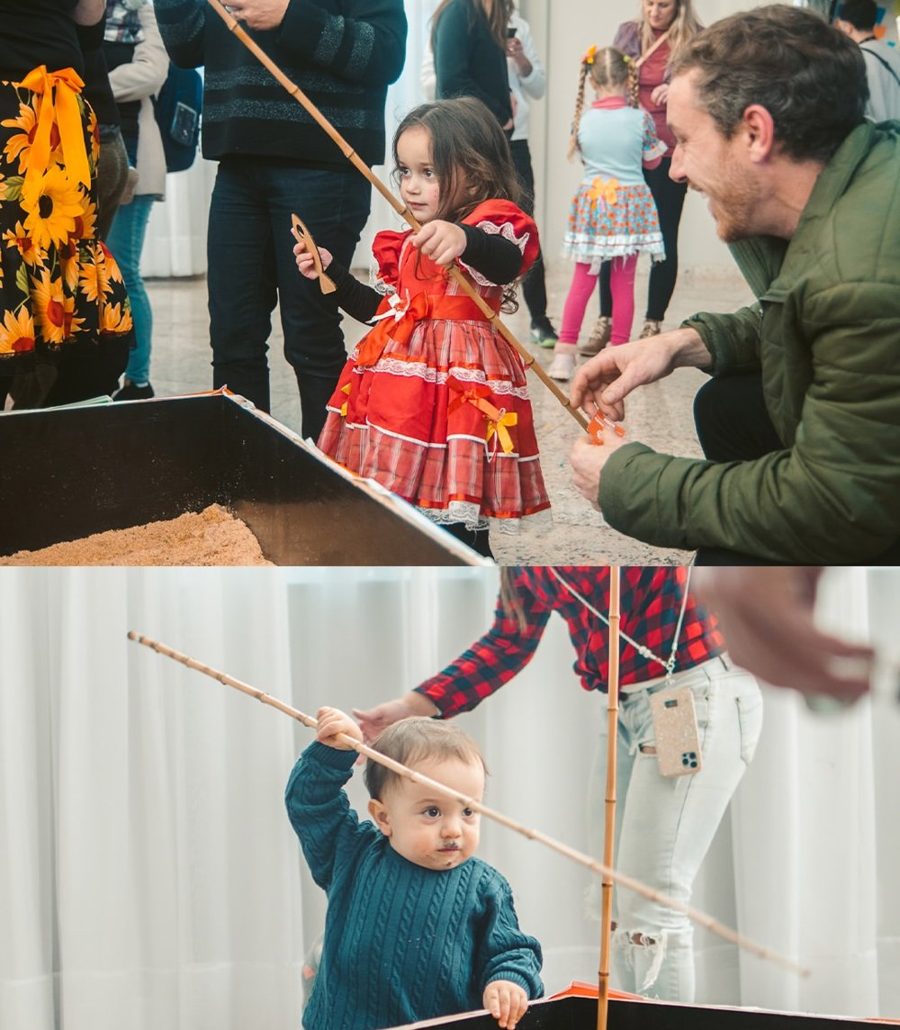 Criança brincando de pescaria em festa junina
