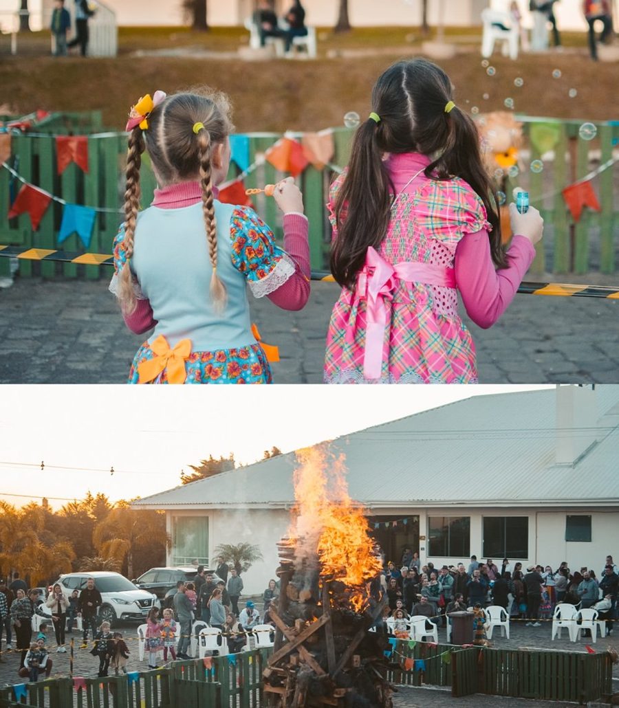 Fogueira e público em festa junina ao ar livre